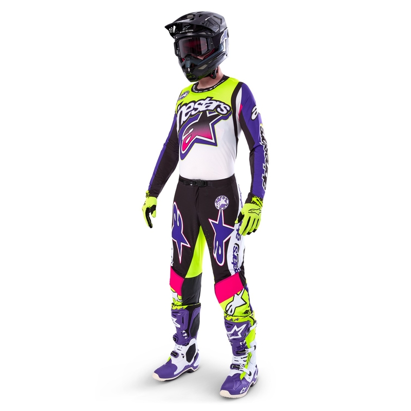 Alpinestars Supertech Dirt Studios baltās-violetās-rozā-fluo dzeltenās motokrosa bikses ar ierobežotu izlaidumu
