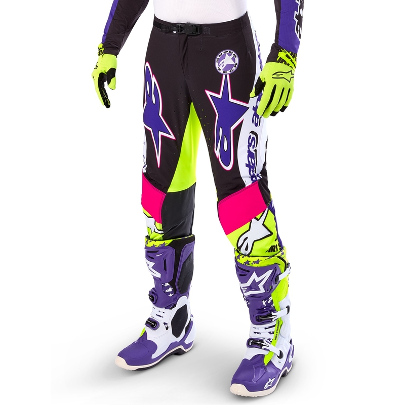 Alpinestars Supertech Dirt Studios baltās-violetās-rozā-fluo dzeltenās motokrosa bikses ar ierobežotu izlaidumu