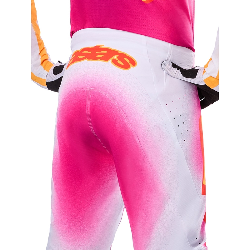 Alpinestars Supertech MIG fluo rozā-baltā-oranžā motokrosa bikses ierobežotā sērijā