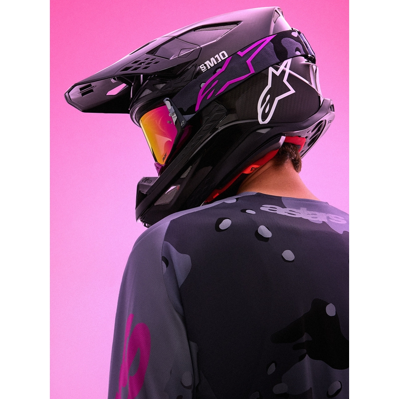 Alpinestars Supertech Lone violetas kamuflāžas motokrosa brilles ar spoguļrozā plexiglasu